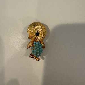 Gold bird brooch